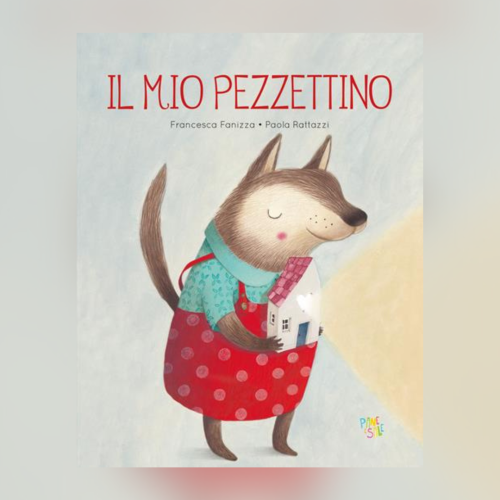 è riportata la copertina del libro "Il mio Pezzettino", con l'illustrazione di un Lupo molto sereno, che indossa una salopette rossa e regge in mano una casetta.